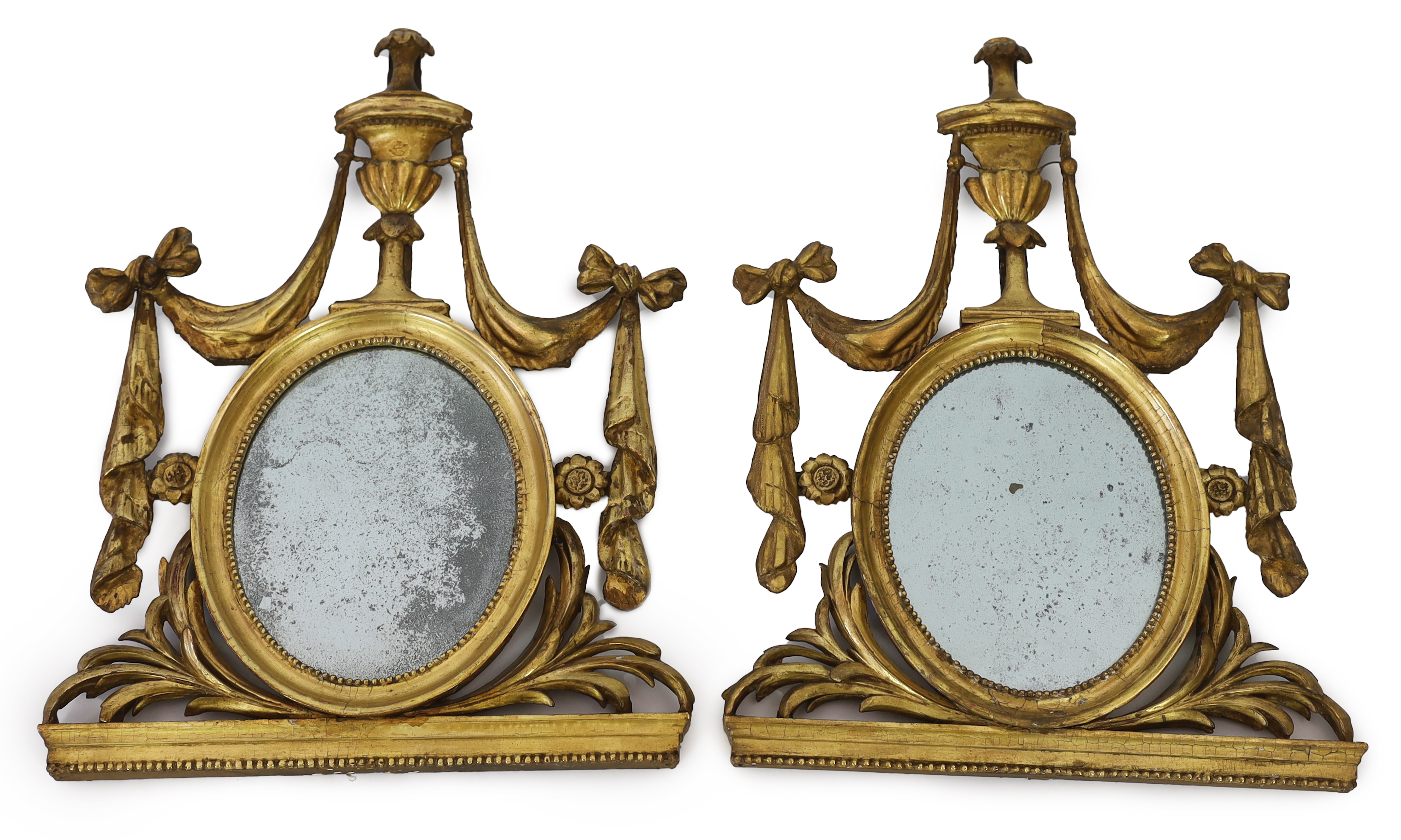 A pair of late 18th century Adam period giltwood wall mirrors